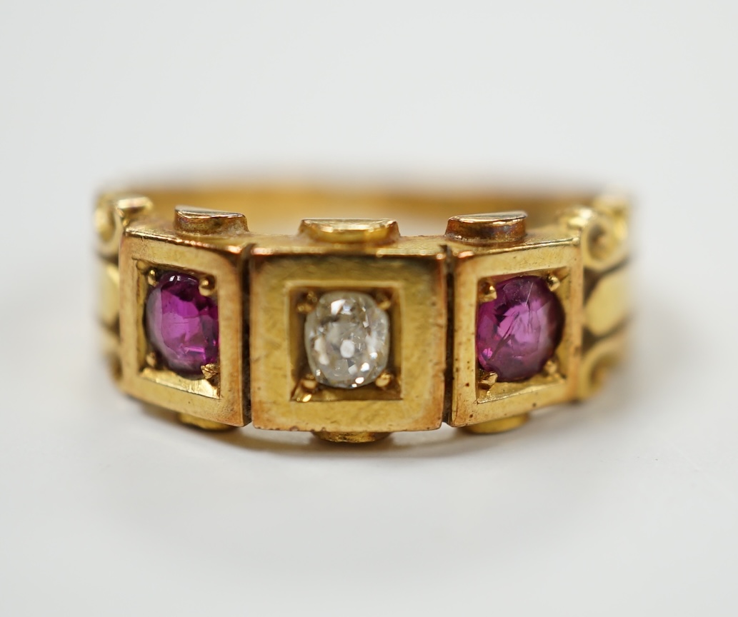 A late Victorian 18ct gold, ruby and diamond set three stone ring, size J, gross weight 4 grams. Condition - fair